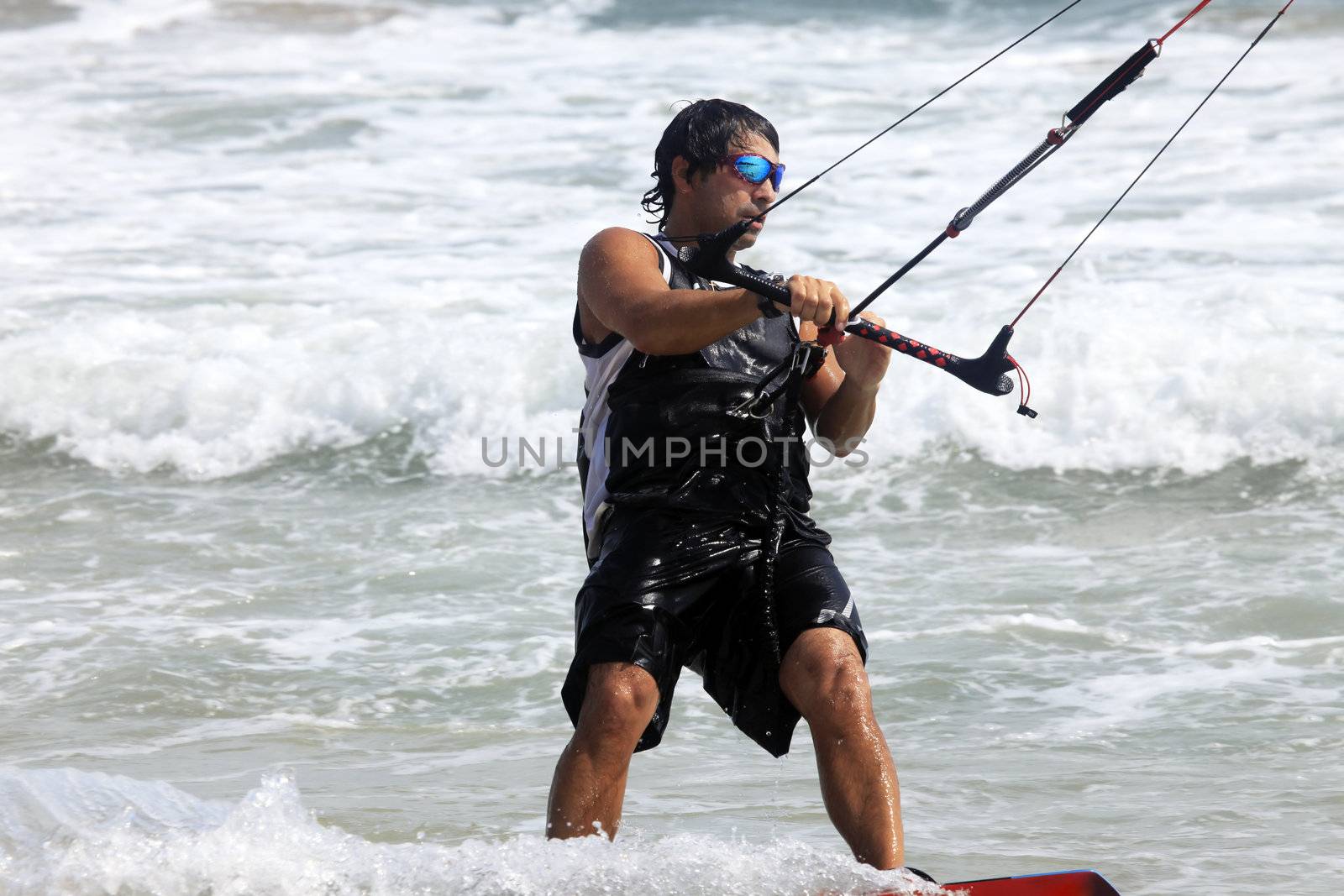 Kiteboarder enjoy surfing in ocean. Vietnam