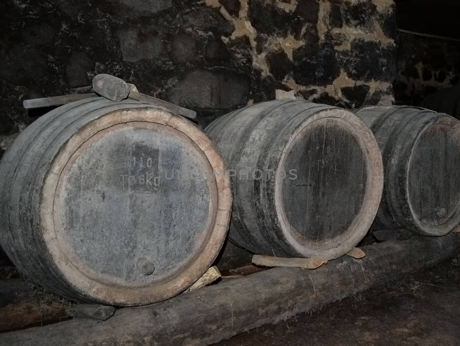 Barrels in the wine-cellar of a rural house.