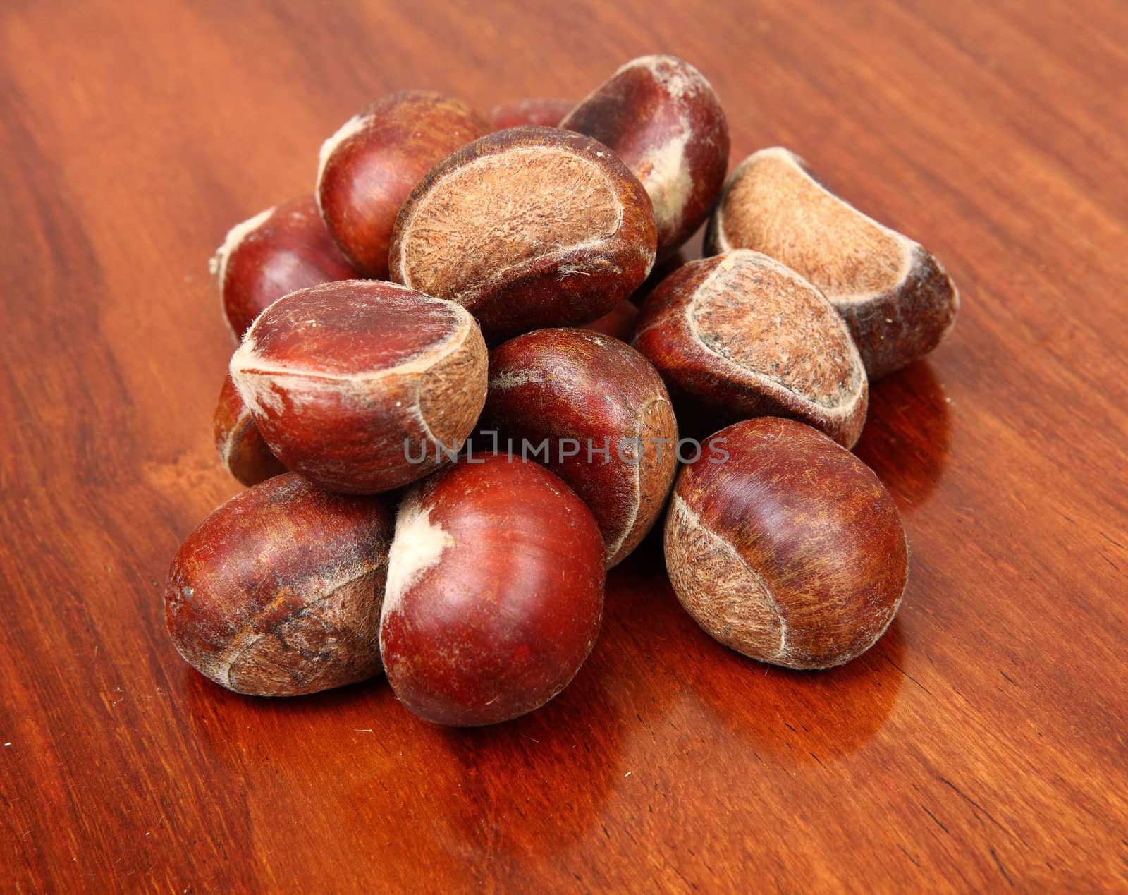 chestnuts on wooden background