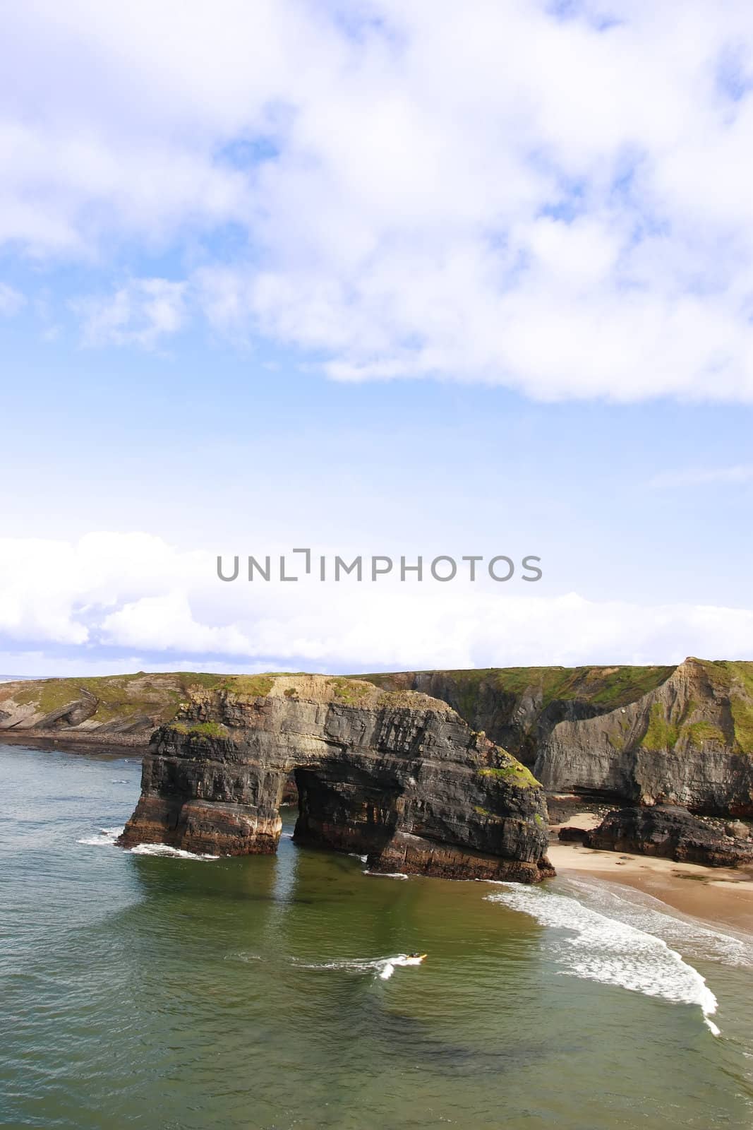 a canoeist at the virgin rock in ballybunion ireland as seen from the cliffs