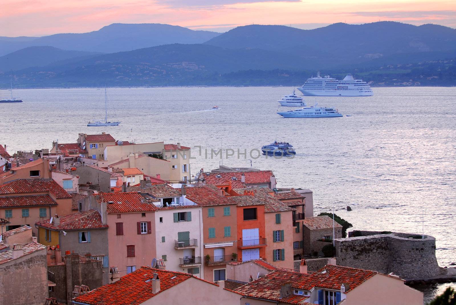 View at St.Tropez and anchored ships at sunset in French Riviera