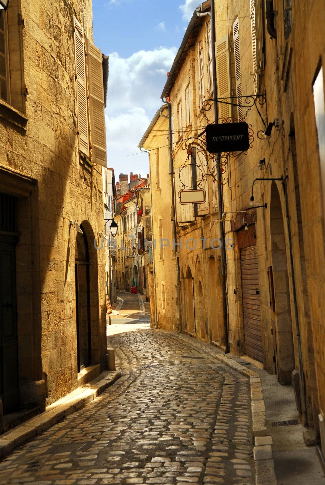 Narrow medieval street in town of Perigueux, Perigord, France