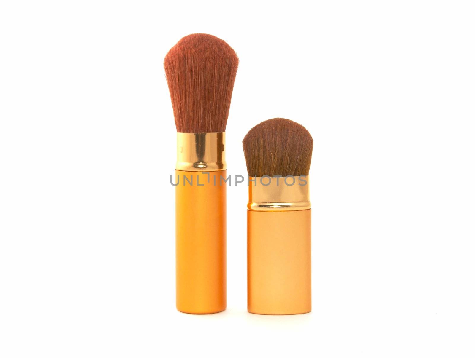 Soft cosmetic brush on a white background