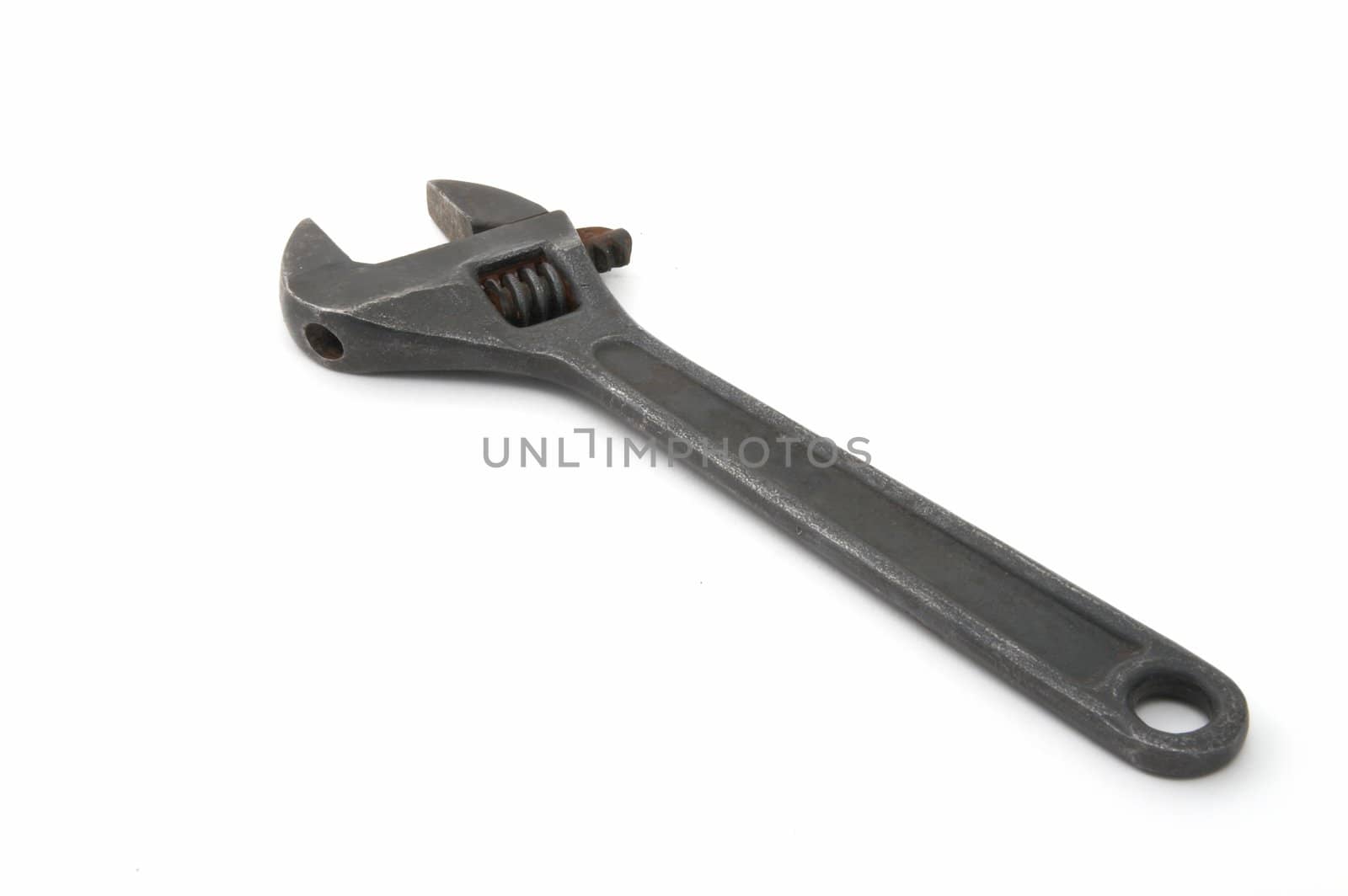 Iron adjustable spanner on a white background