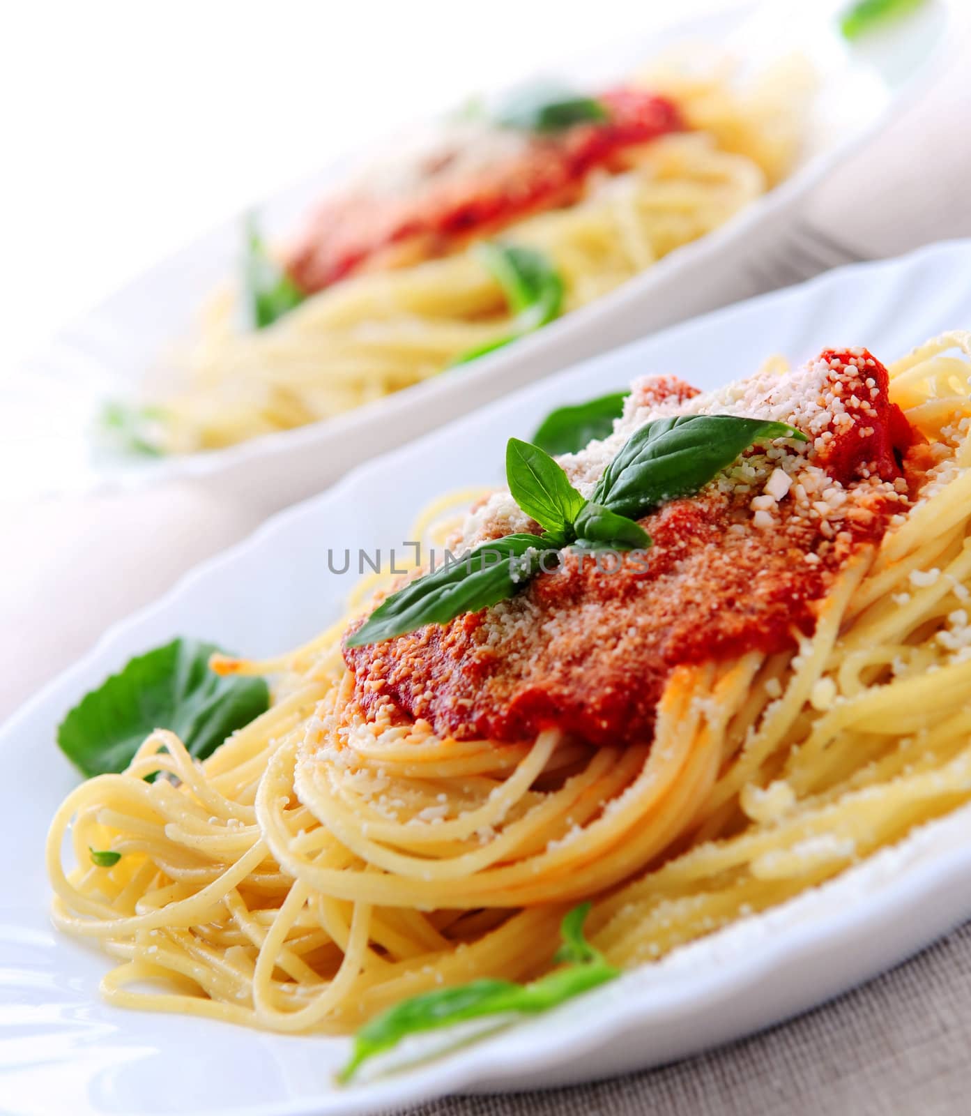 Pasta with tomato sauce basil and grated parmesan