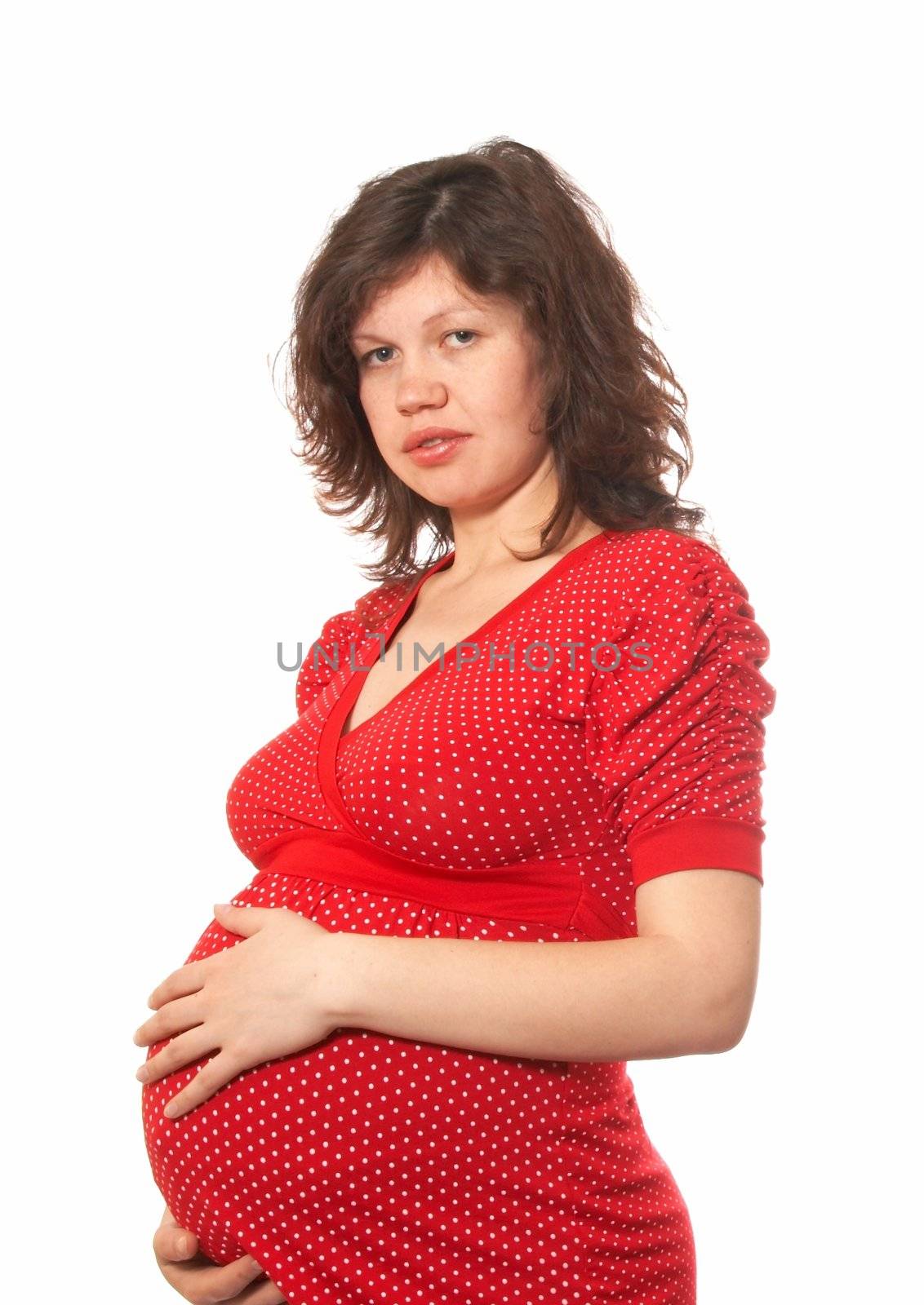 Portrait of the pregnant woman in a red dress with white points