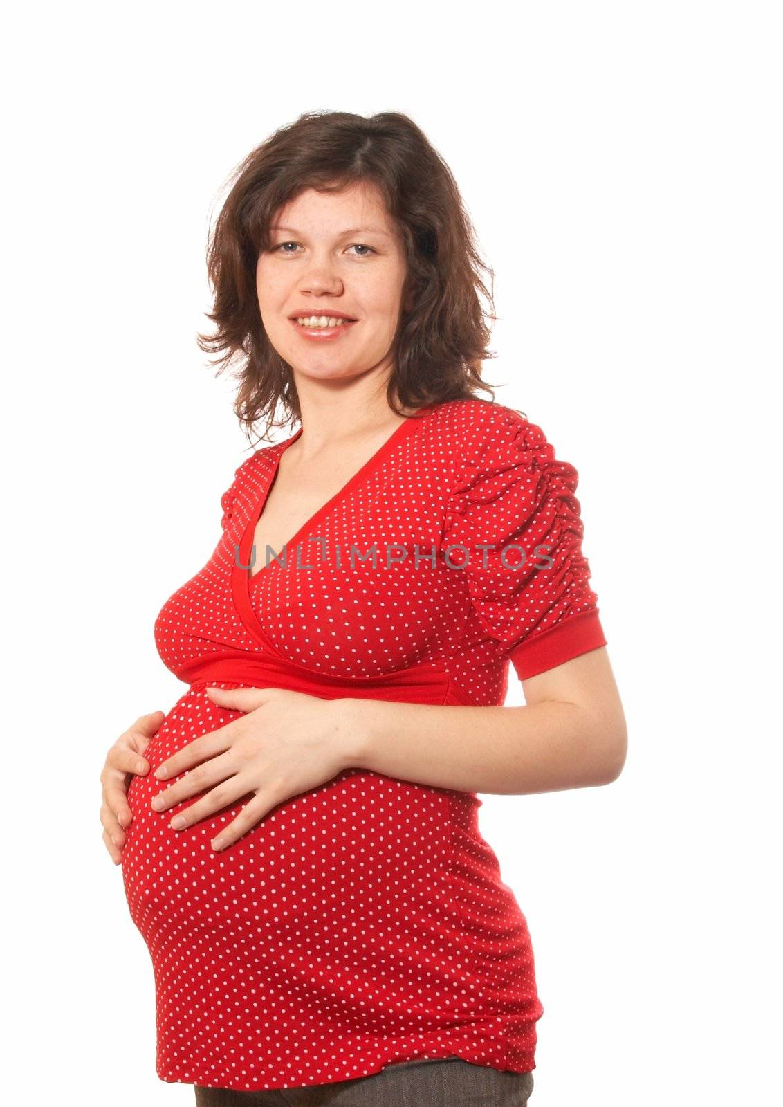 Portrait of the pregnant woman in a red dress with white points