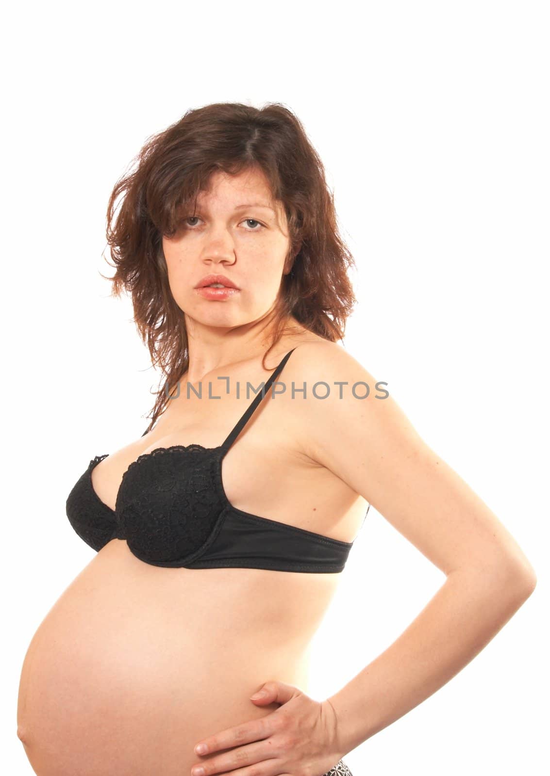 Portrait of the pregnant womanin a black bra