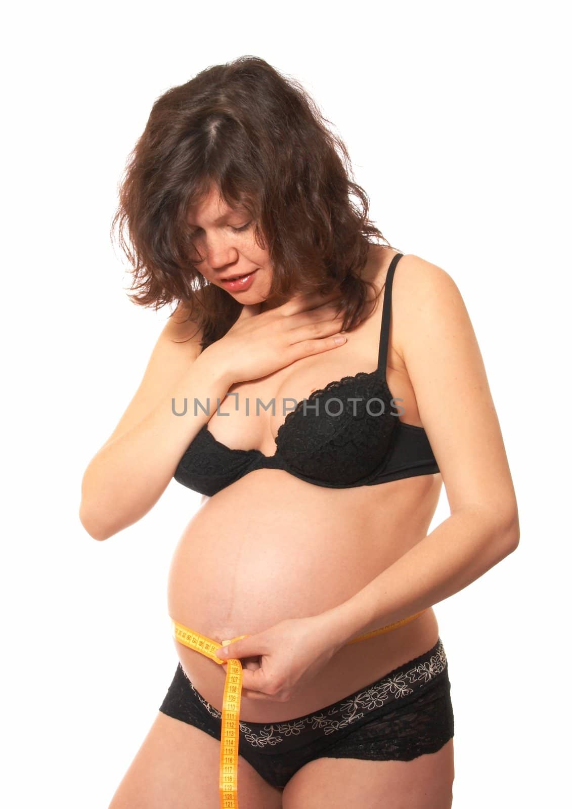 Portrait of the pregnant woman in black underwear