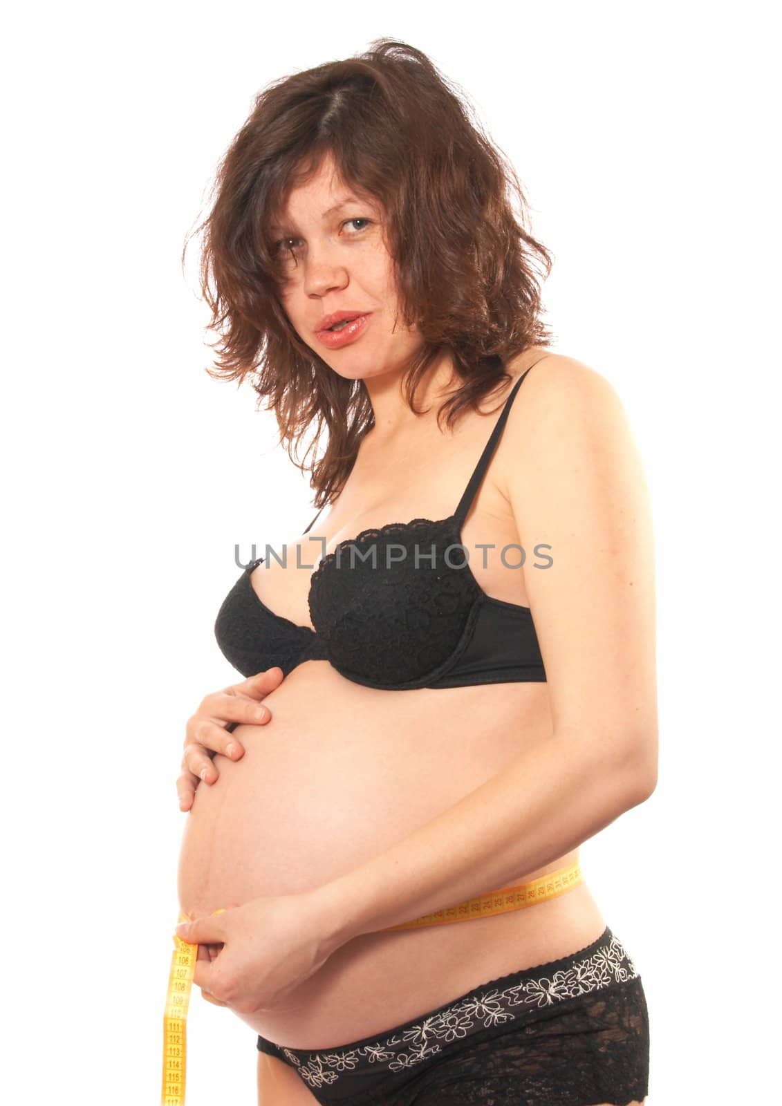 Portrait of the pregnant womanin a black bra