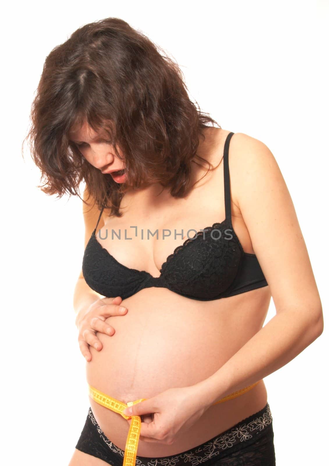 Portrait of the pregnant womanin a black bra