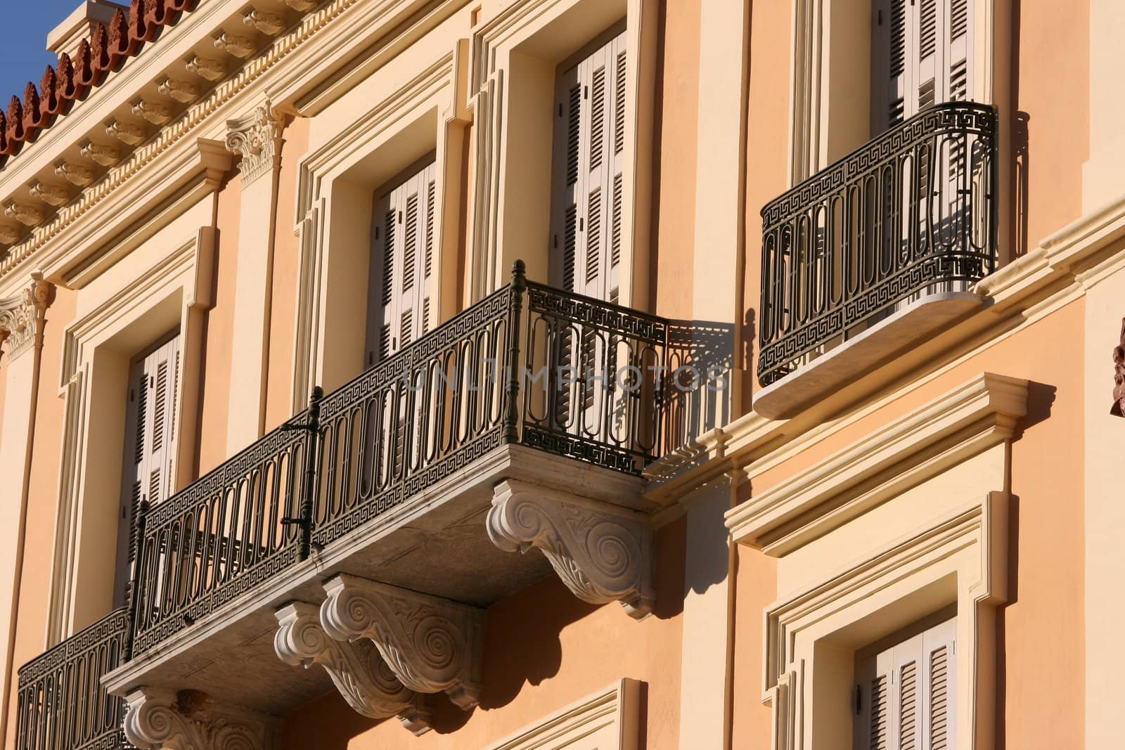 front view of noeclassical building on sunset architecture backgrounds
