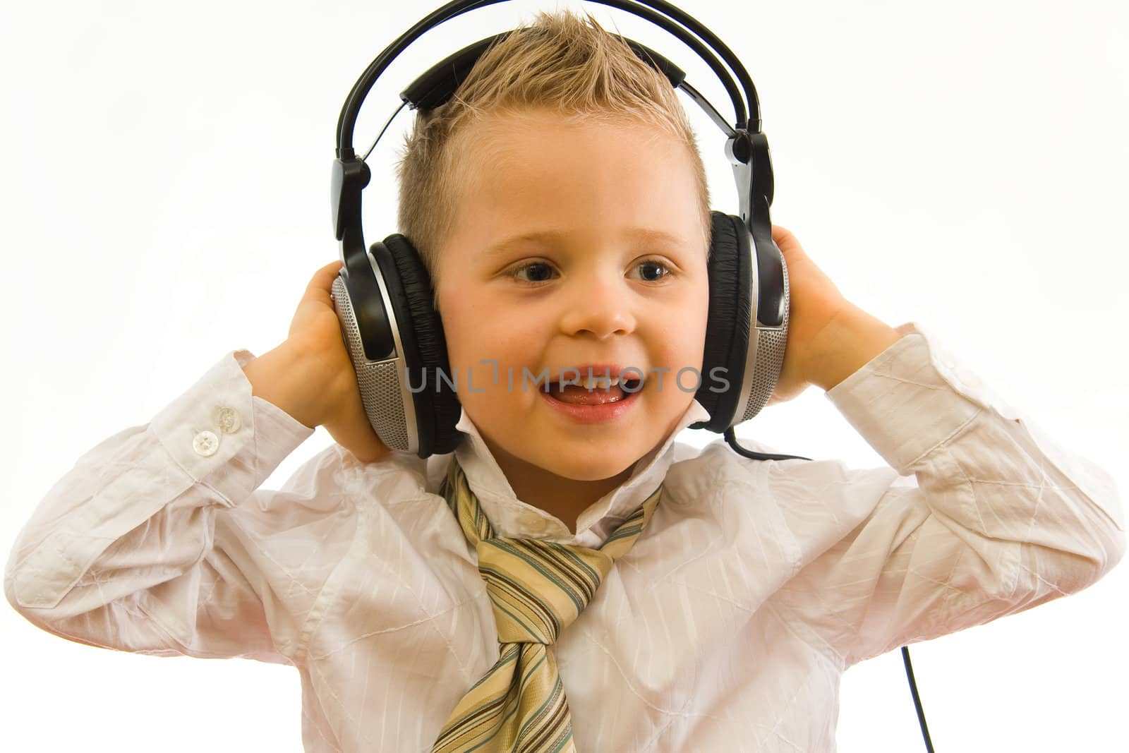 Child with headphones listening music