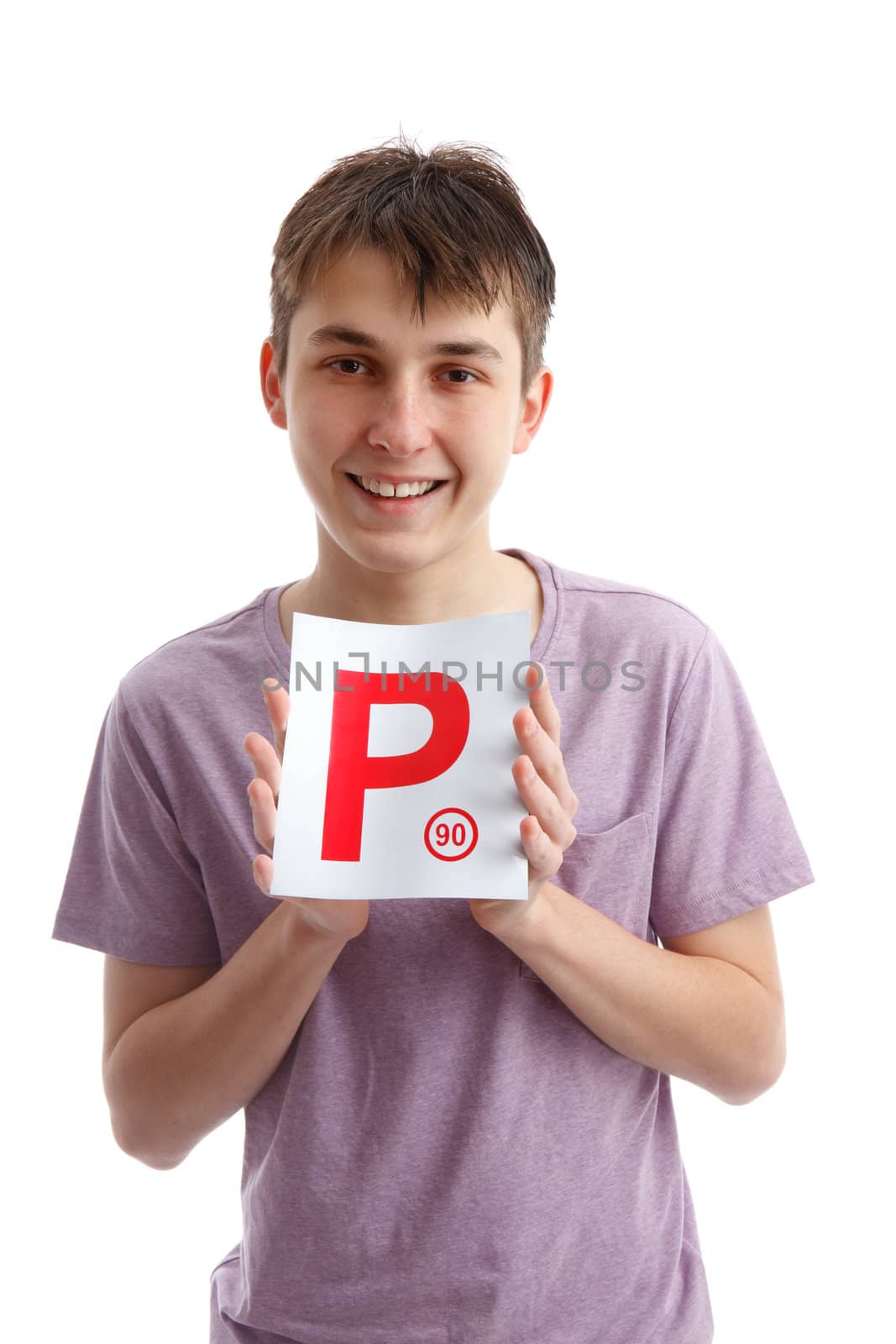 A teenager holding a magnetic P plate sign for the car. Provisional license.   White background.
