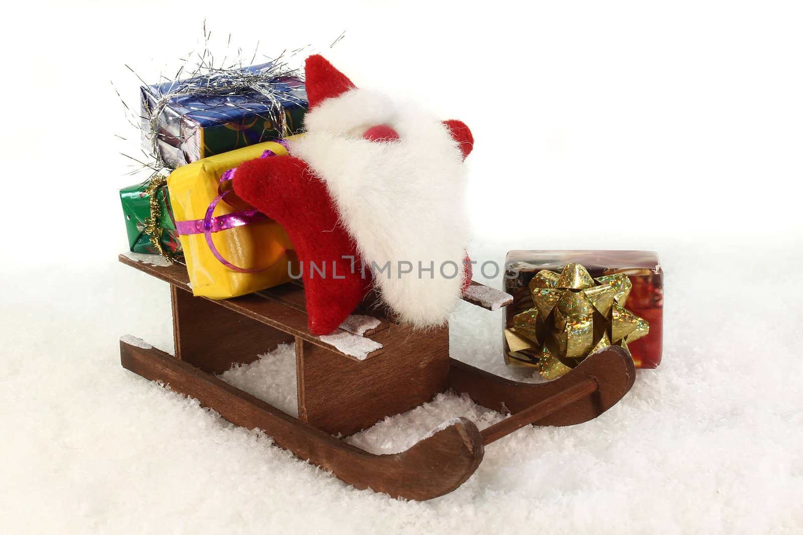 A slide with colorful gifts in the snow