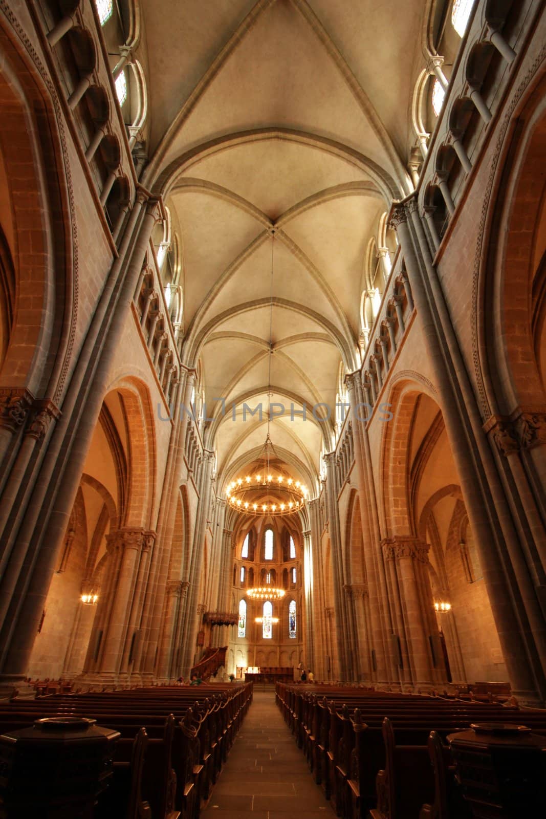 Inside the protestant Saint-Peter's cathedral in Geneva, Switzerland. The construction started in 1160 and lasted about one century. After that, it's been modified several times, sometimes because of fire. At XVI century, when the protestant Reformation advented, the inside was modified to have less decoration.