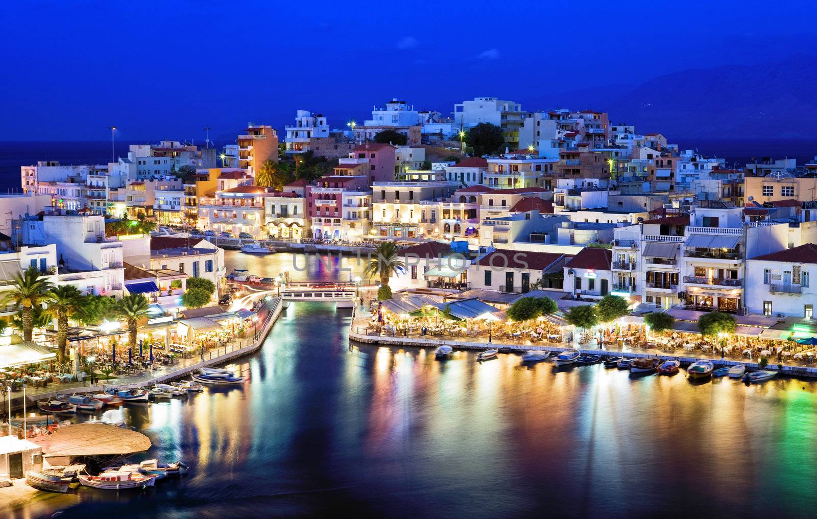 Agios Nikolaos.Agios Nikolaos is a picturesque town in the eastern part of the island Crete built on the northwest side of the peaceful bay of Mirabello.
