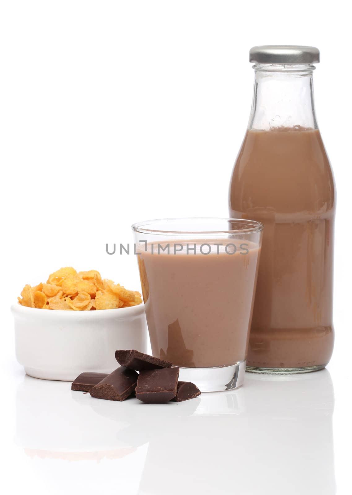 Chocolate milk and cornflakes over white background by Erdosain