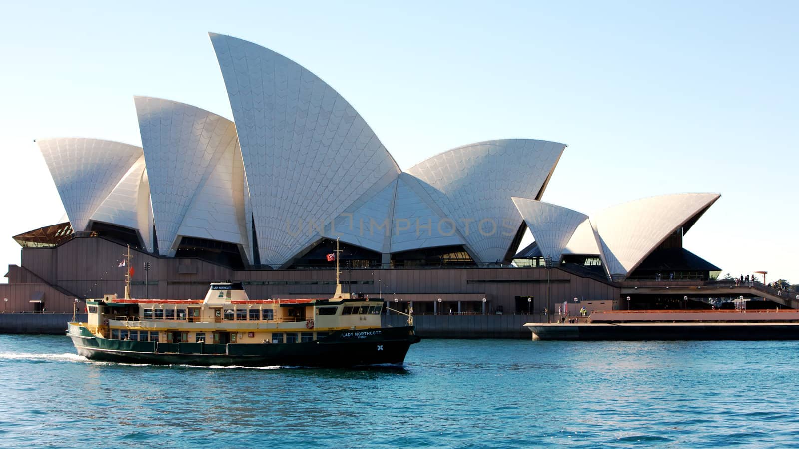 Sydney Opera House in Australia with a ferry boat
