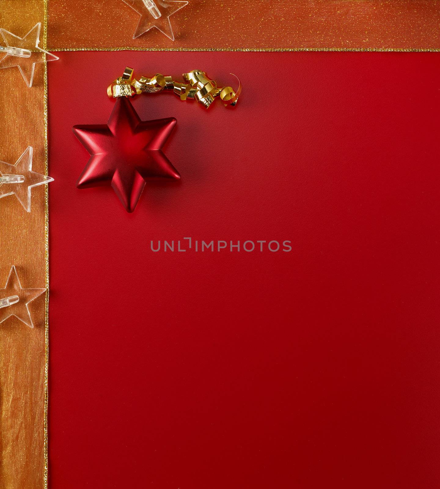 Christmas ornaments on a red background with copy space.