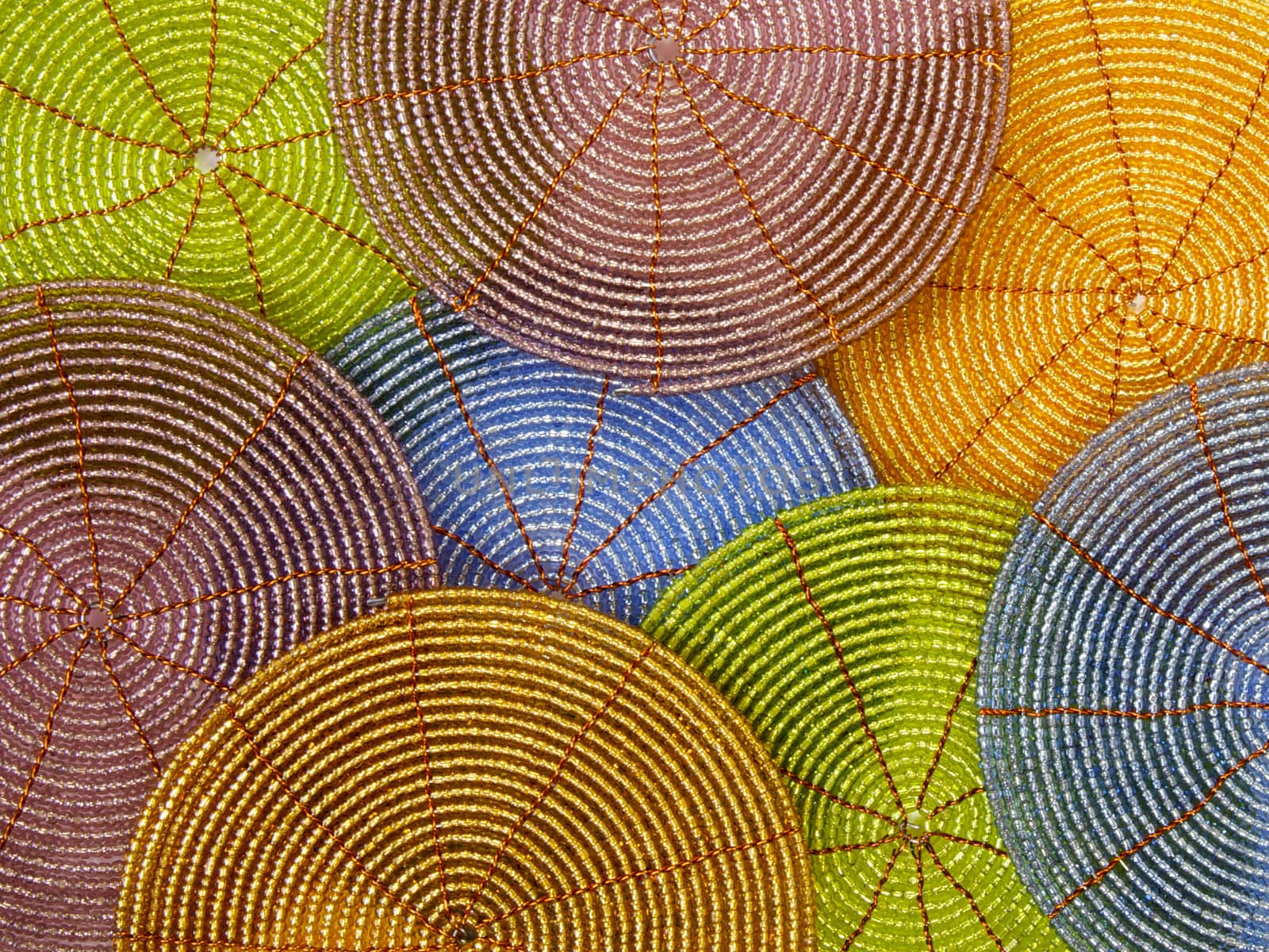 Beaded coasters in bright colours, background