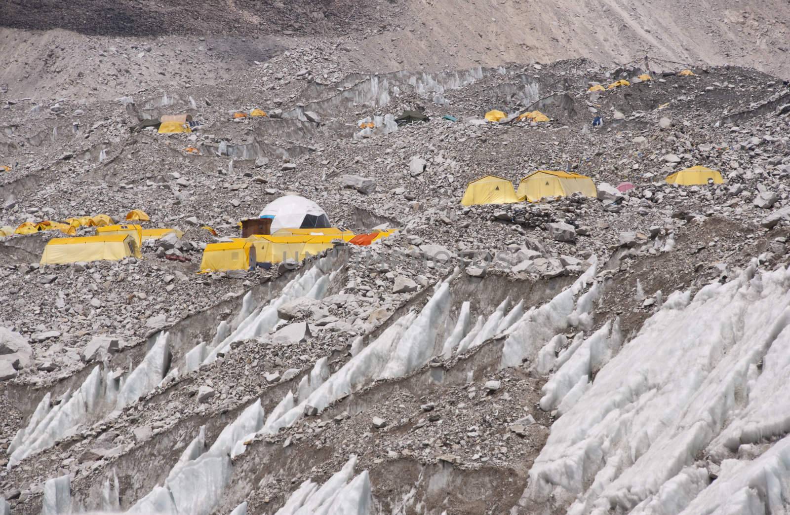 Everest Base Camp. Cluster of yellow tents on the rubble strewn Khumbu glacier at the base of Mount Everest, Nepal