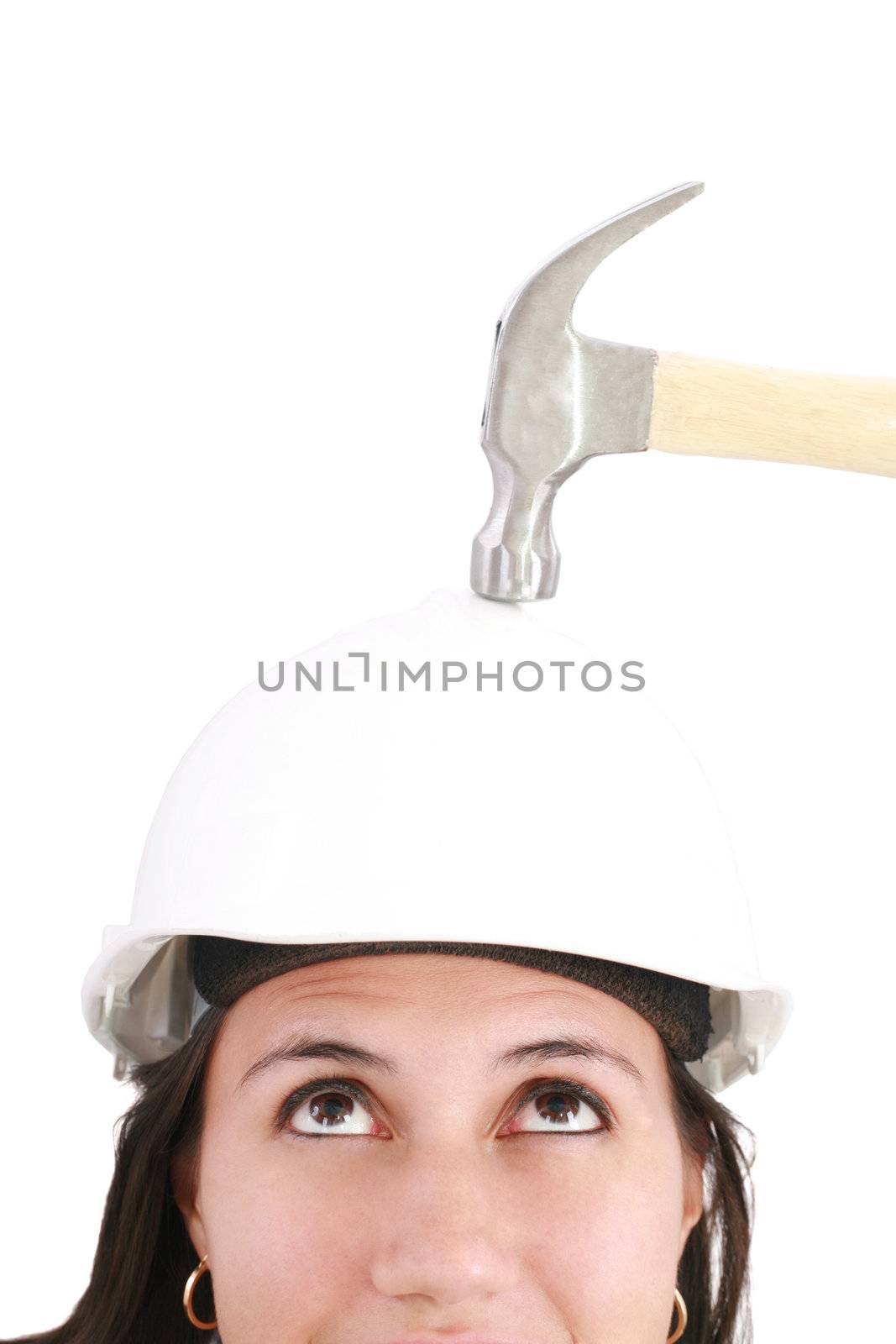 girl with safety helmet about to be hit by a hammer over a white background