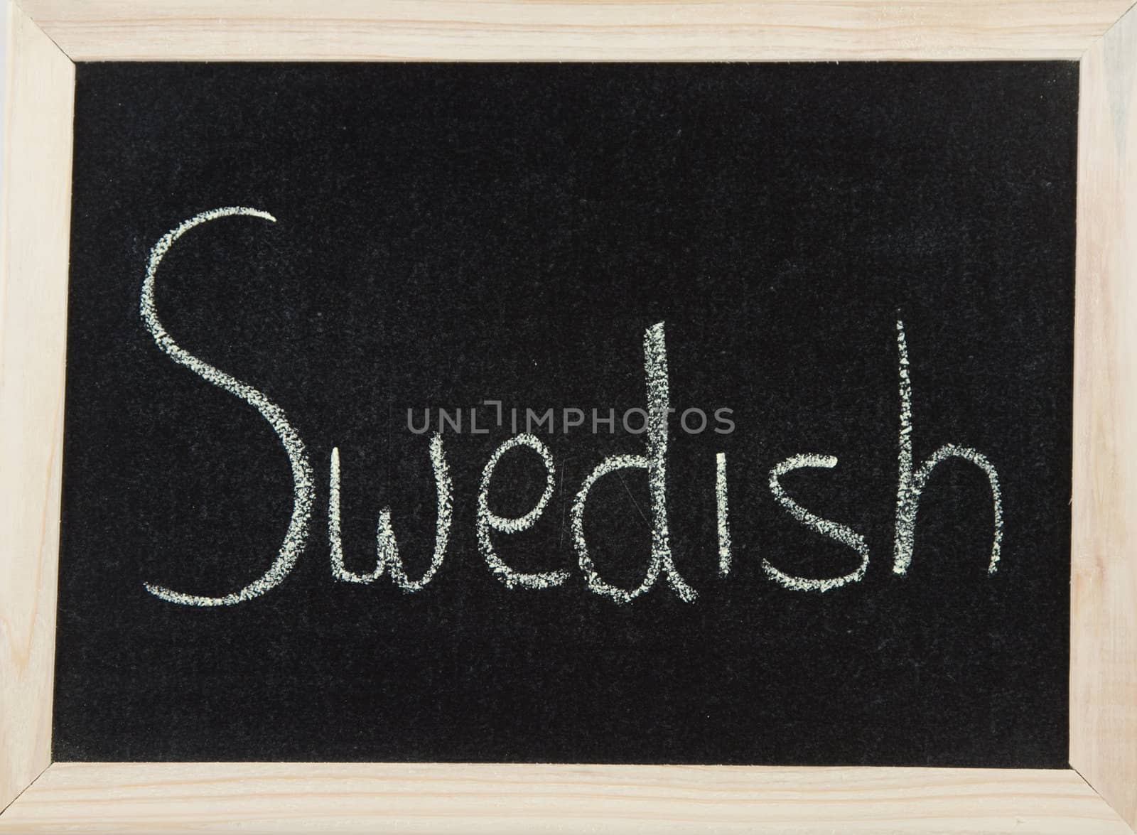 A black board with a wooden frame and the word 'SWEDISH' written in chalk.