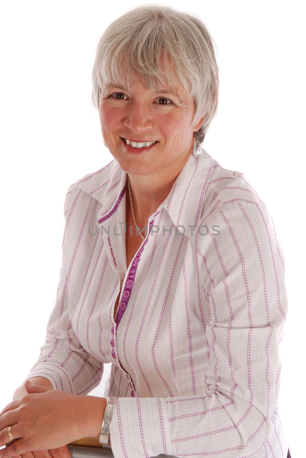 Portrait of a senior business woman on white.