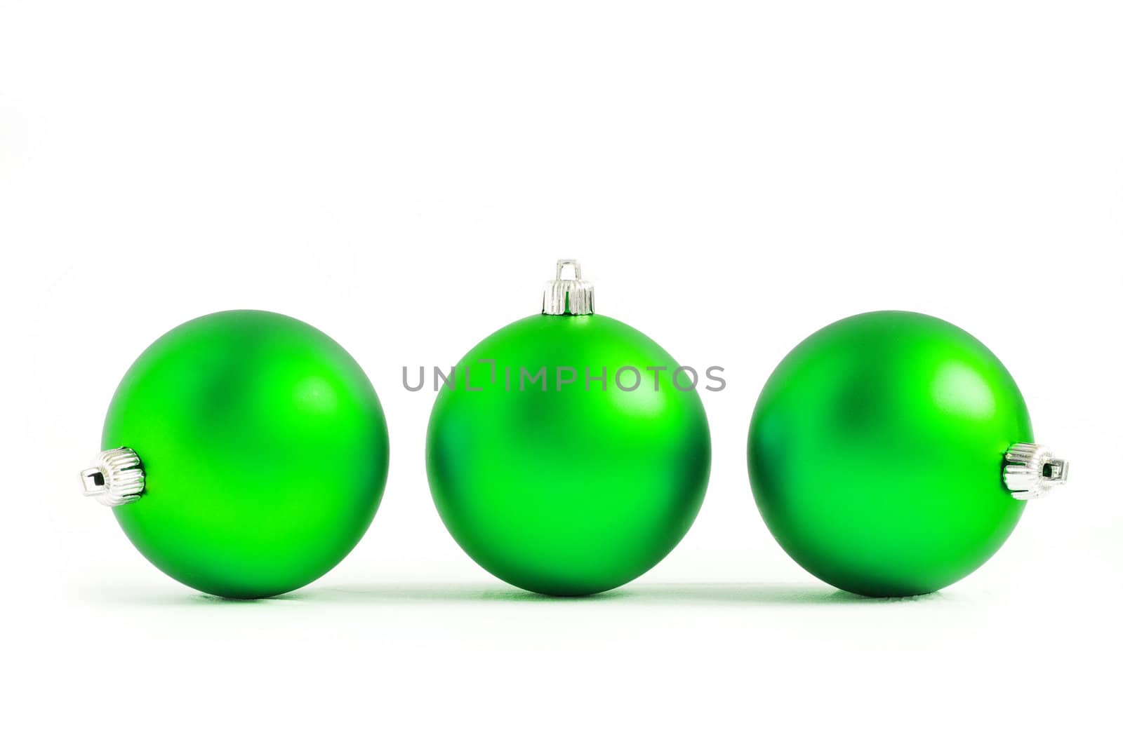green christmas balls  isolated on a white