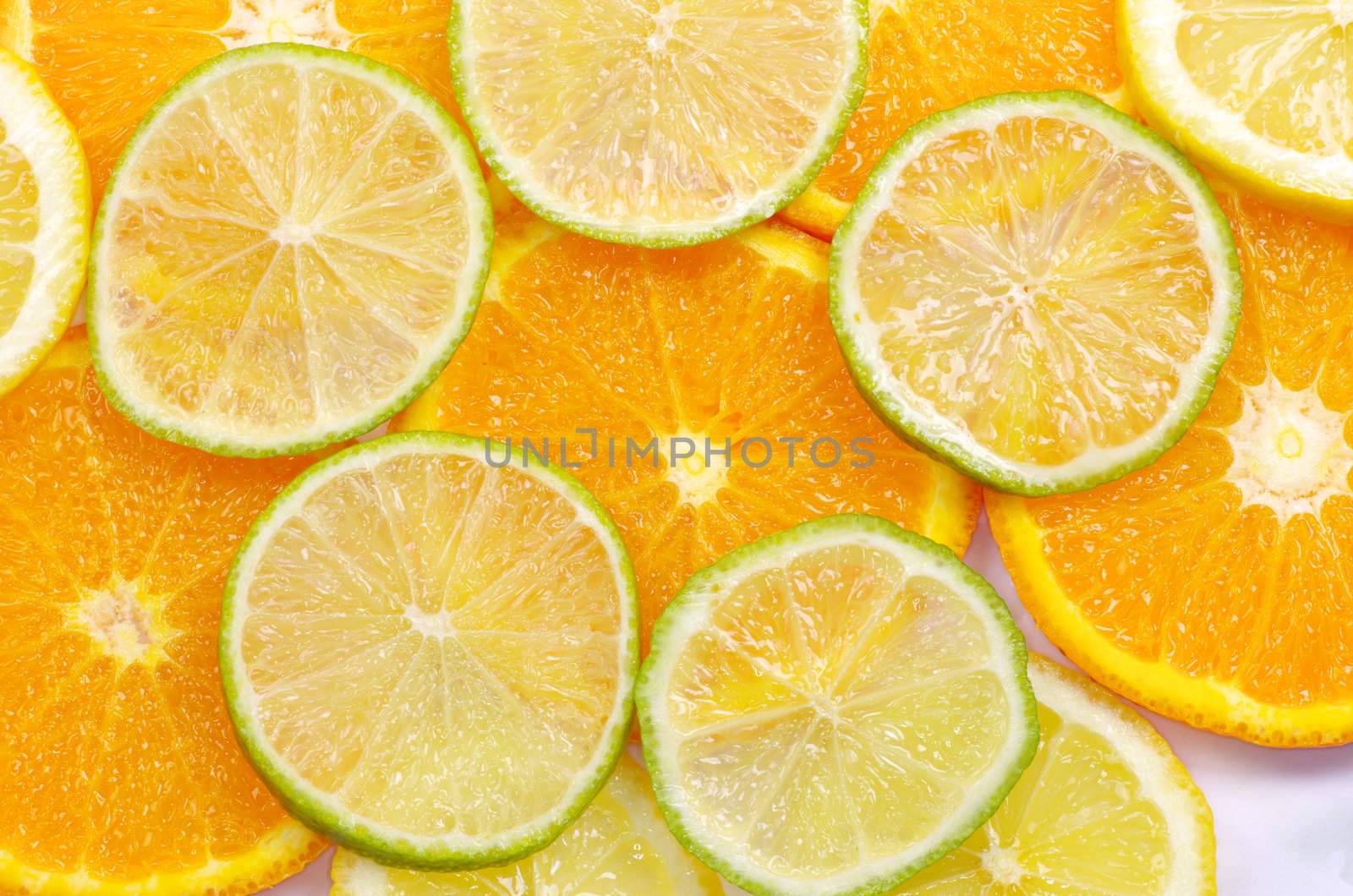 Mixed sliced citrus fruit background