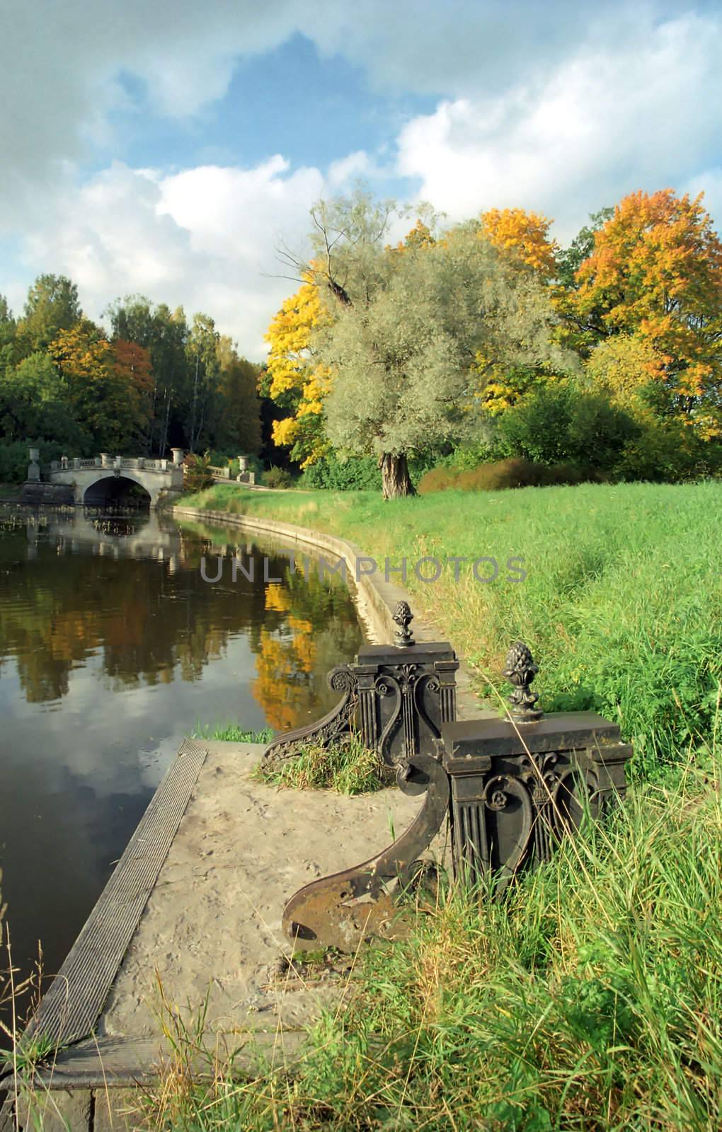 Old pier in old autumn park
