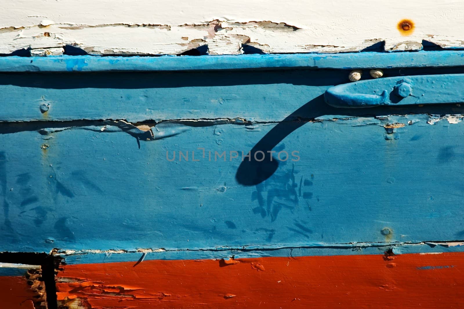 Close-up of a boat's peeling paint