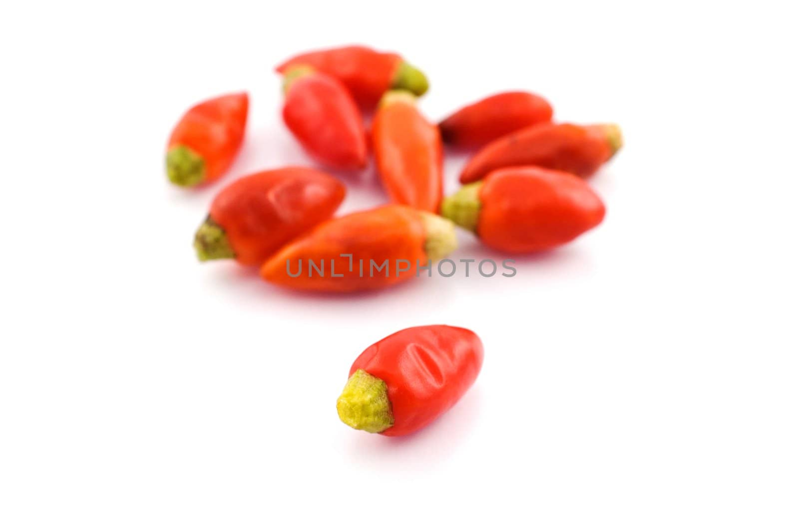 Chili peppers on white background with selective focus