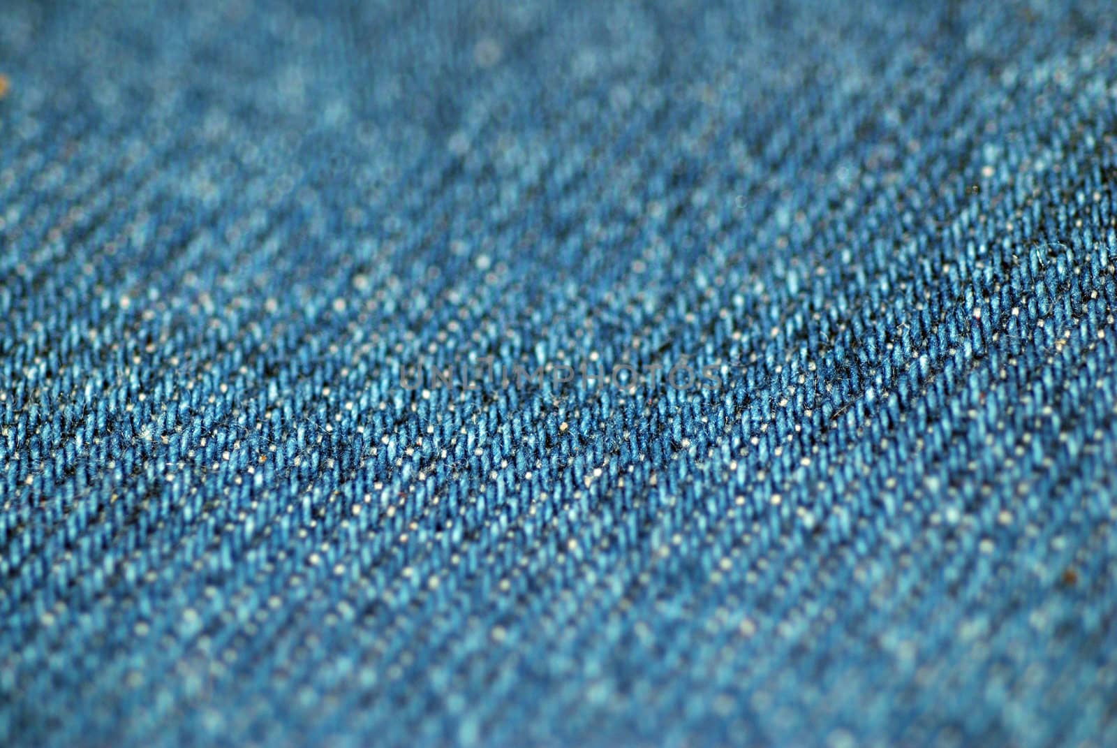 An extreme close-up macro shot of blue denim