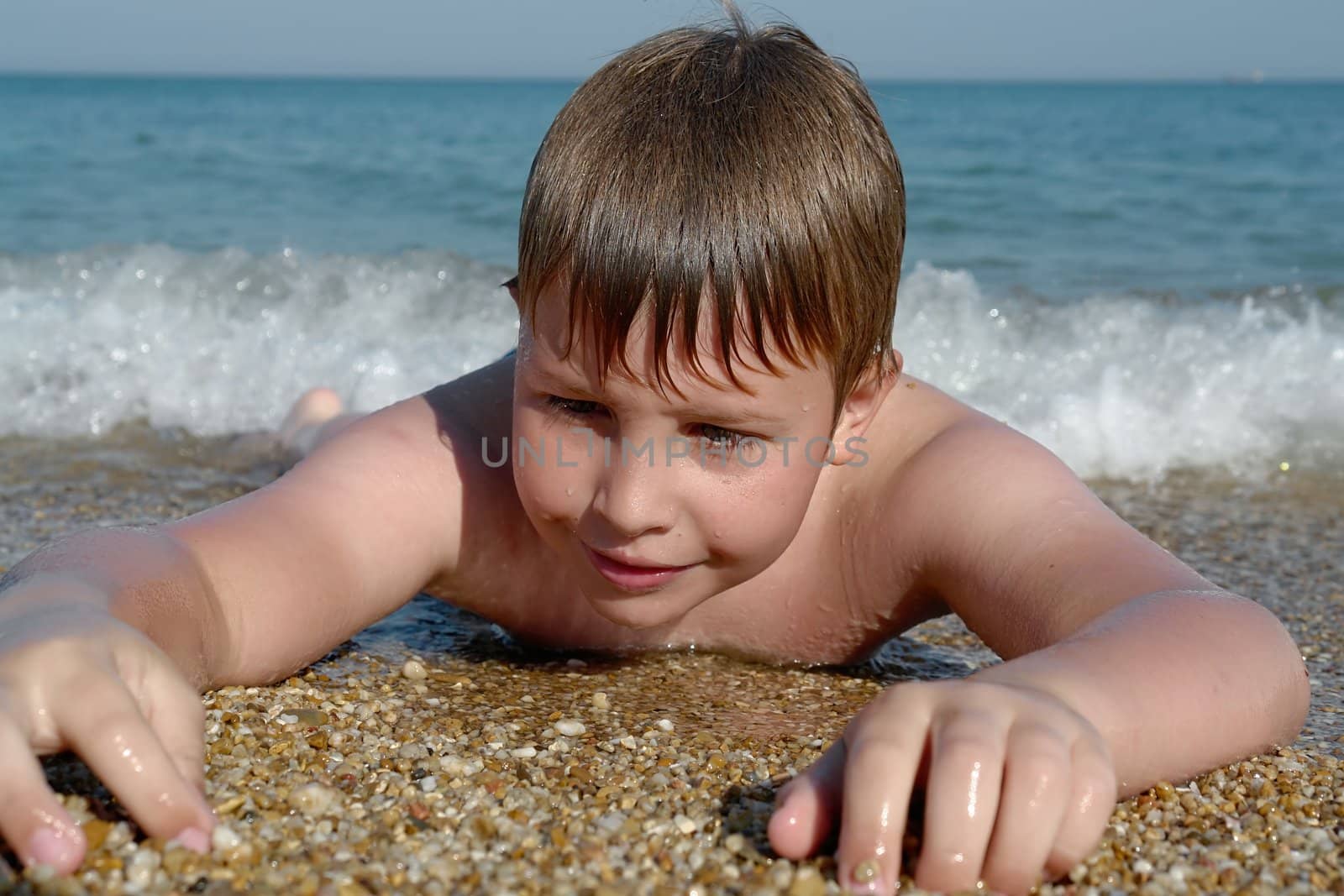 Boy At Beach. Happy vacation moment at the beach.