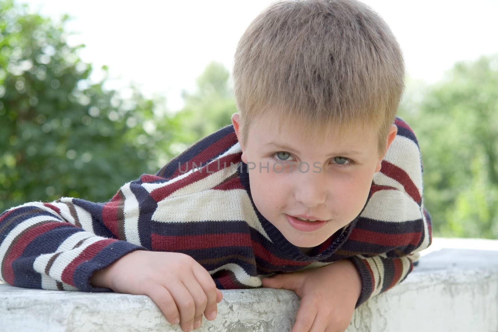 little boy with summer park at background