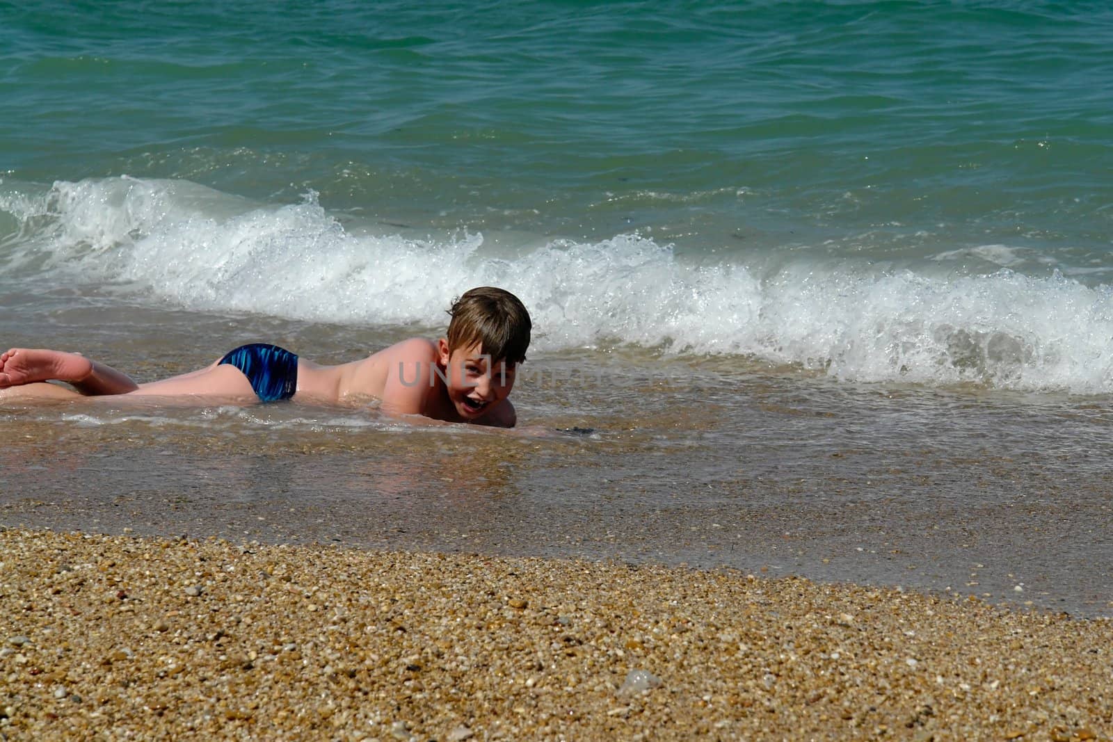 Boy At Beach. Happy vacation moment at the beach.