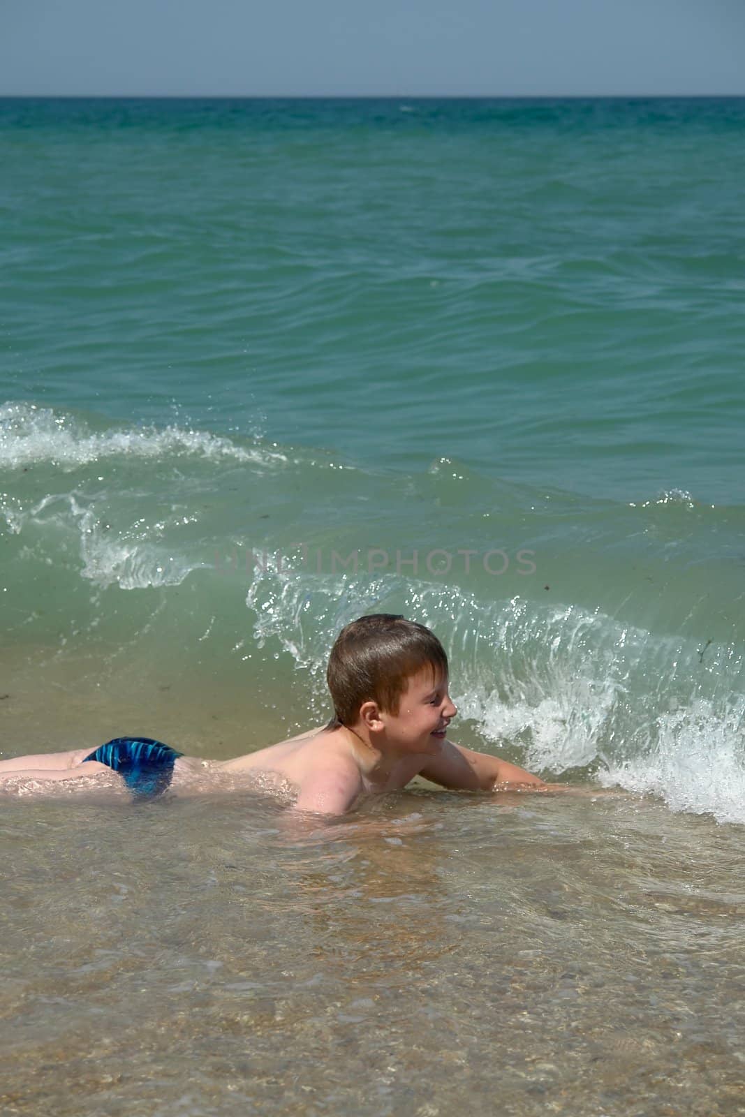 Boy At Beach. Happy vacation moment at the beach.