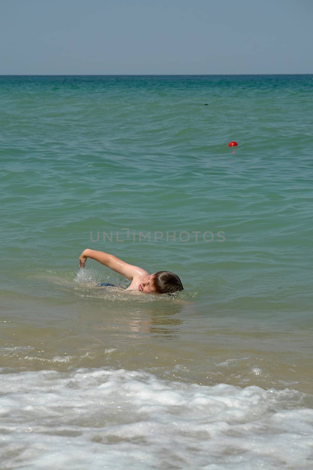 Boy At Beach. Happy vacation moment at the beach.