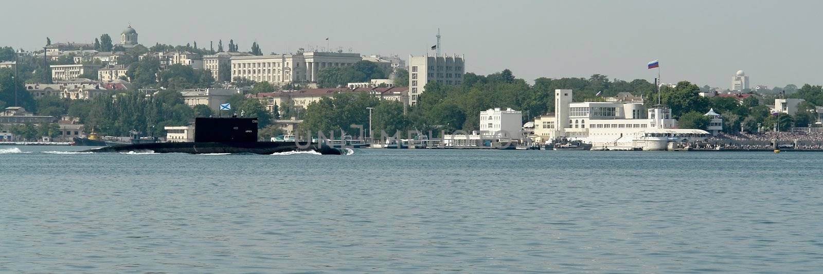 military submarine will sail with Sevastopol city at background