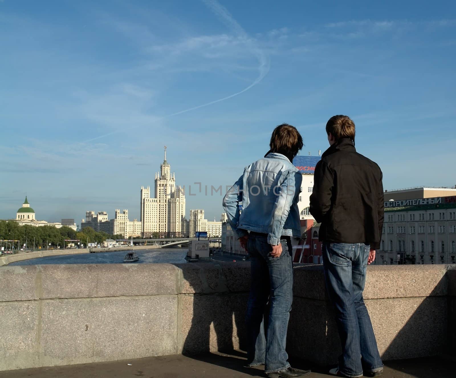 Two boys from the bridge view the Moscow sights
