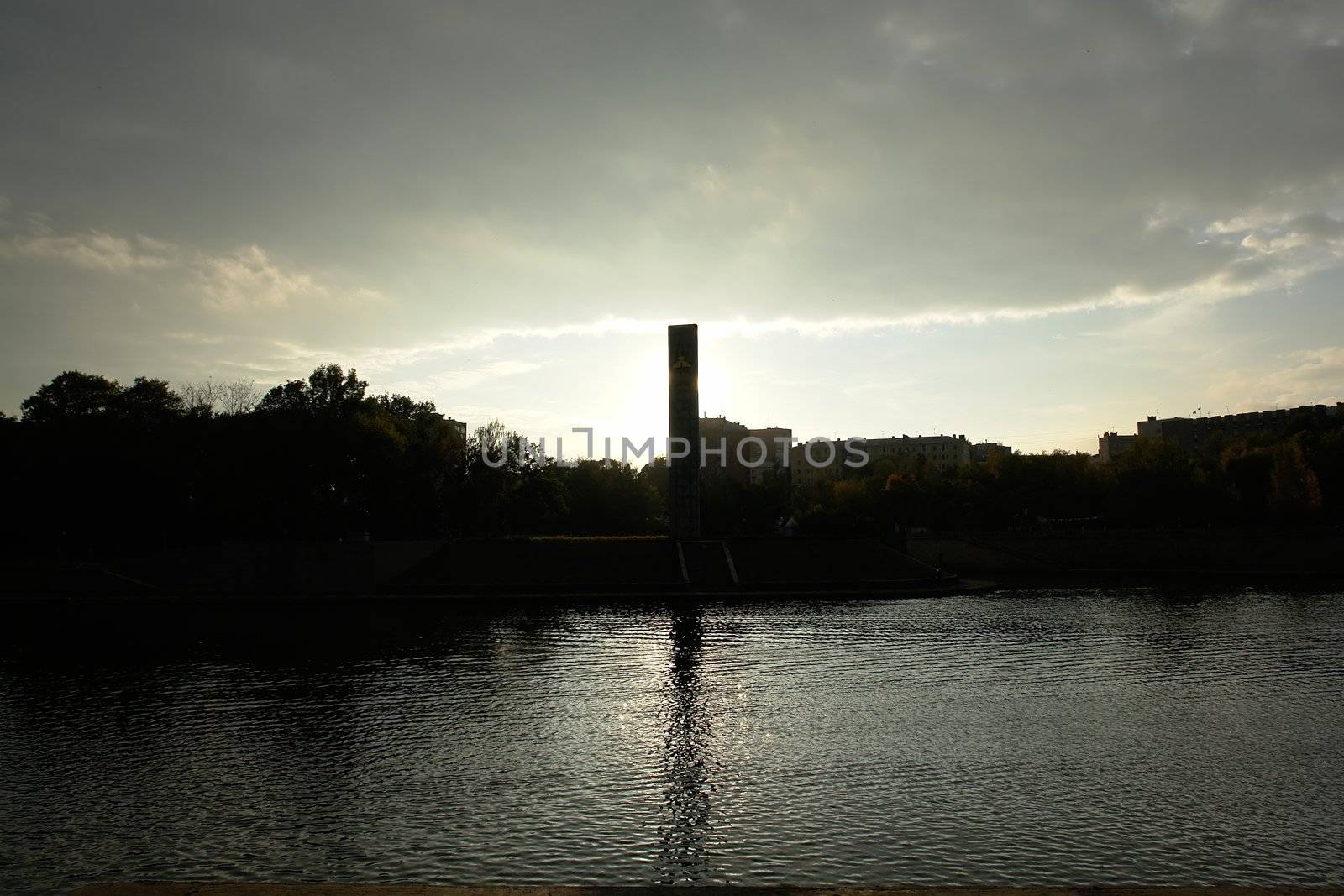 Reflection in the river with sunset at background