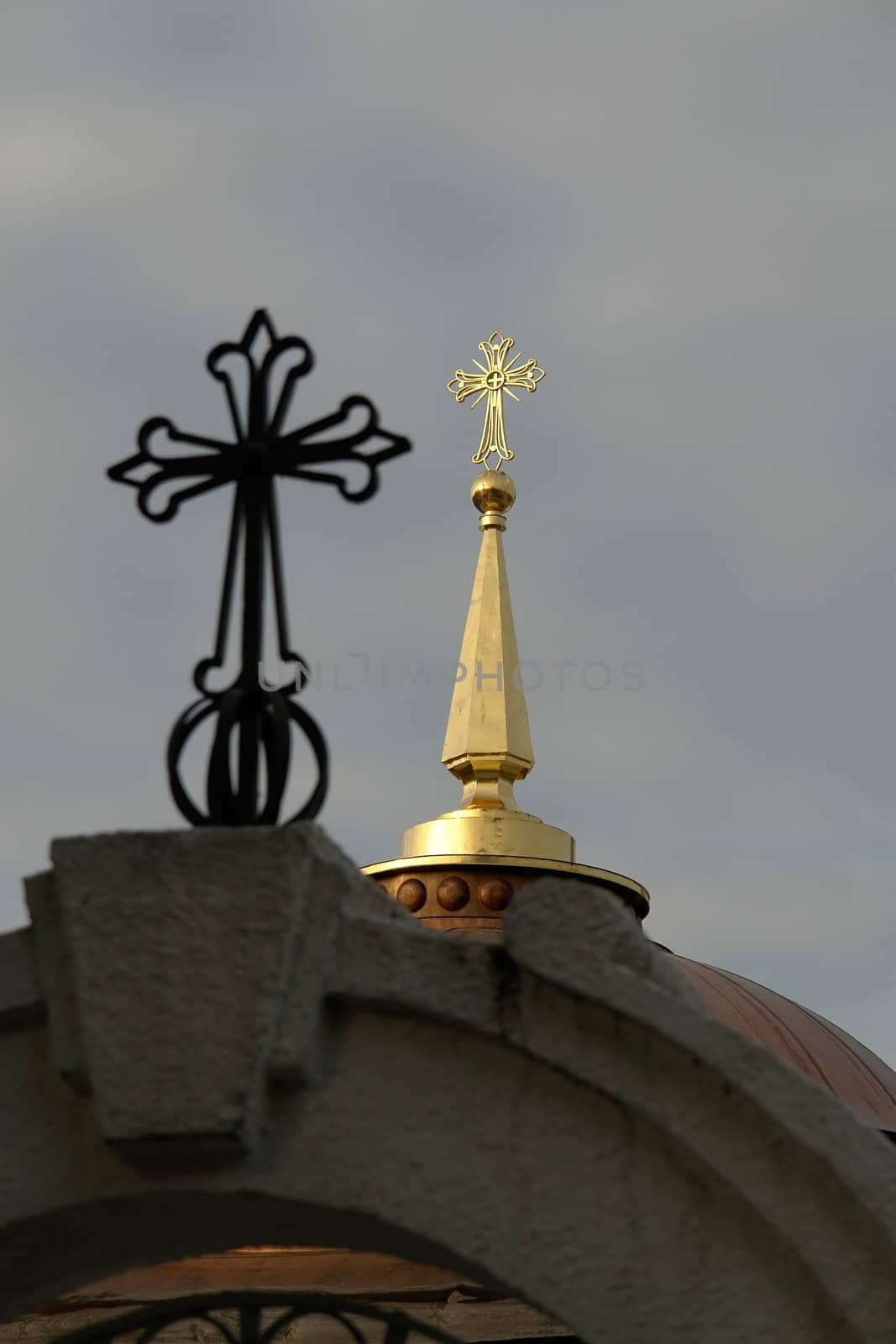 crosses on the cupolas of orthodox temple with sky at background