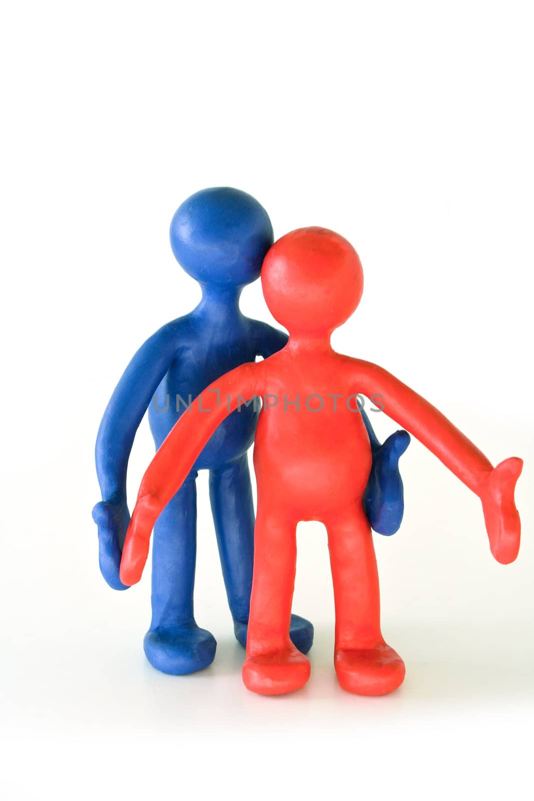 Two colored plasticine puppets standing on white background