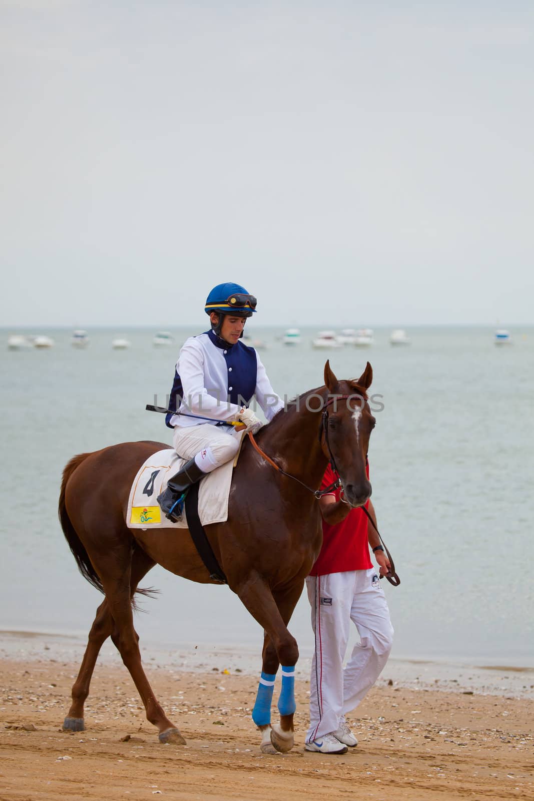 SANLUCAR DE BARRAMEDA, CADIZ, SPAIN - AUGUST 07: Unknown rider at the start of the horses races of the beach of Sanlucar de Barrameda on August 07, 2010 in Sanlucar de Barrameda, Cadiz, Spain.