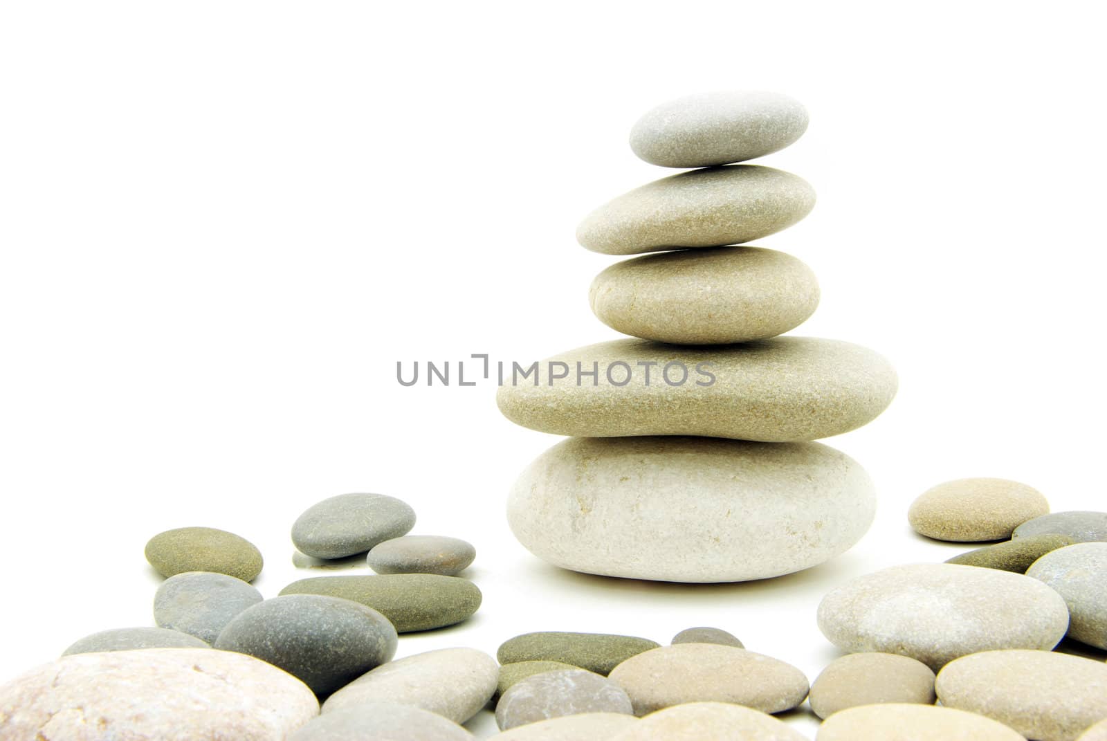 Stack of balanced stones on a white background