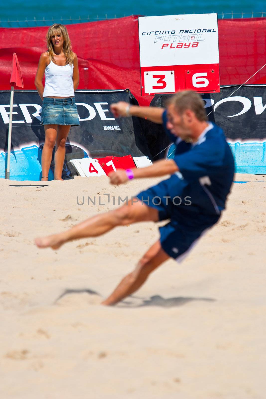 CADIZ, SPAIN -  JUL 30:  Unknown player of the team of Cadiz playing the Spanish Championship of Beach Soccer on Jul 30, 2005 on the beach of La Victoria in Cadiz, Spain