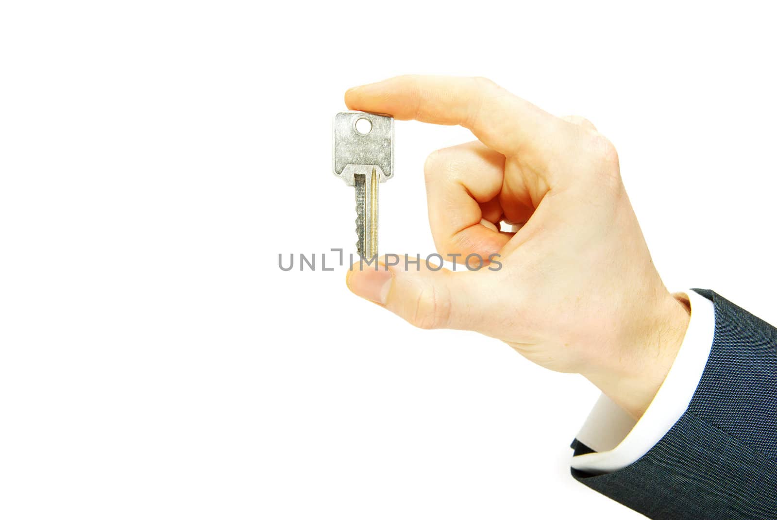 hand holds a key isolated on white