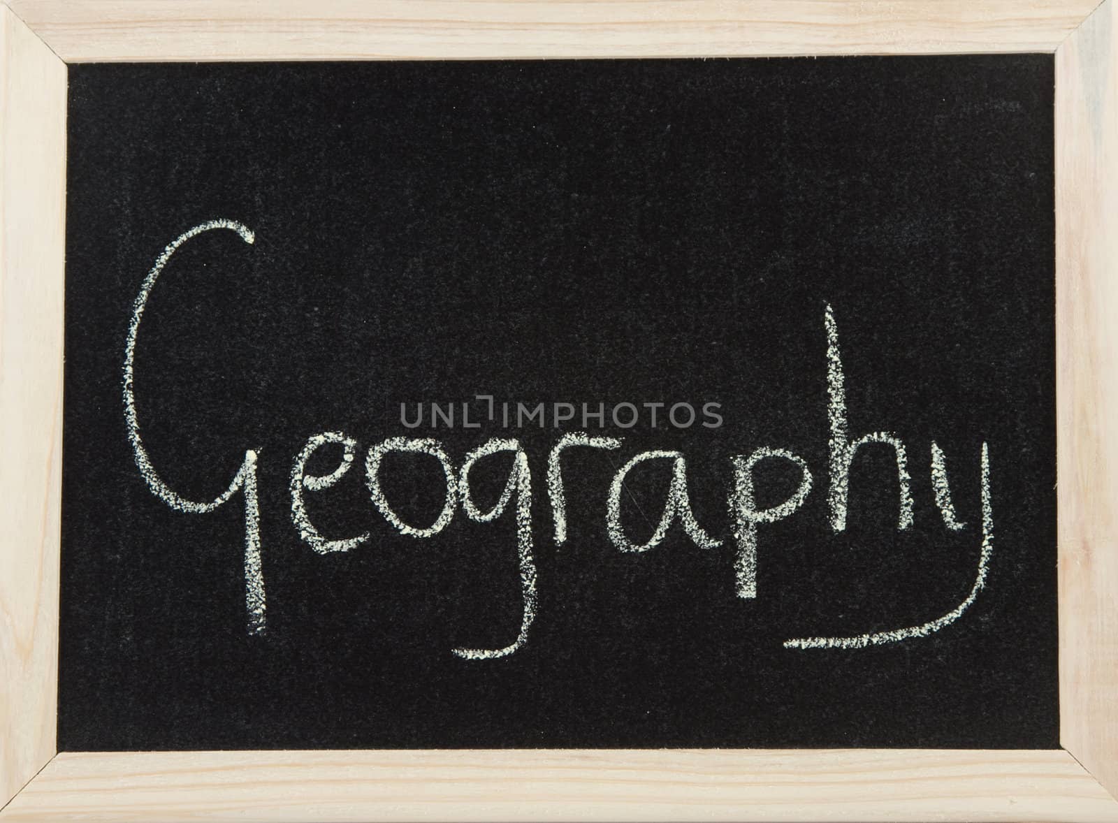 A black board with a wooden frame and the word 'GEOGRAPHY' written in chalk.